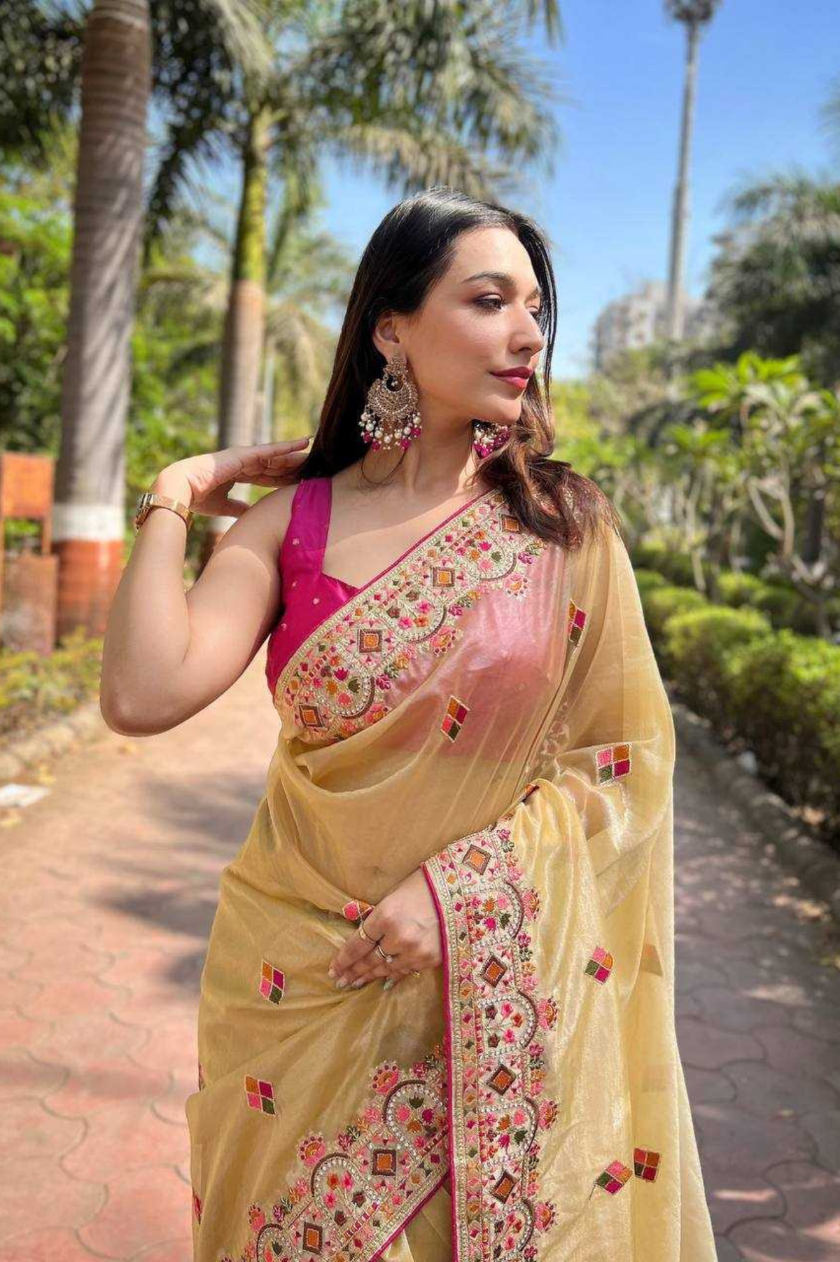 Elegant Golden Twill Net Saree with Embellished Diamond Work & Tassel Border