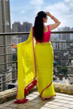 Neon Yellow Georgette Saree with Pink Lace Border & Tassels