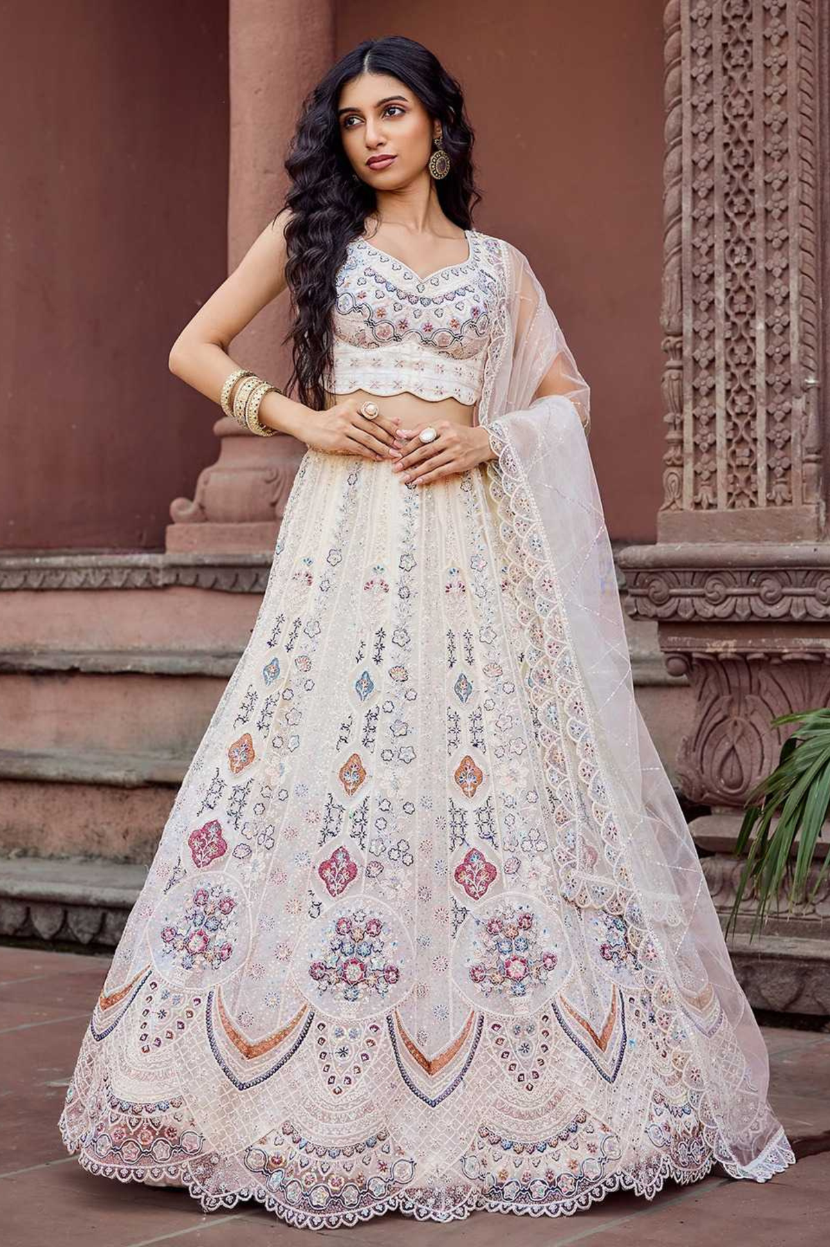 Adorned Cream Net Sequins & Thread Embroidered Bridal Lehenga Set