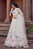 Adorned Cream Net Sequins & Thread Embroidered Bridal Lehenga Set