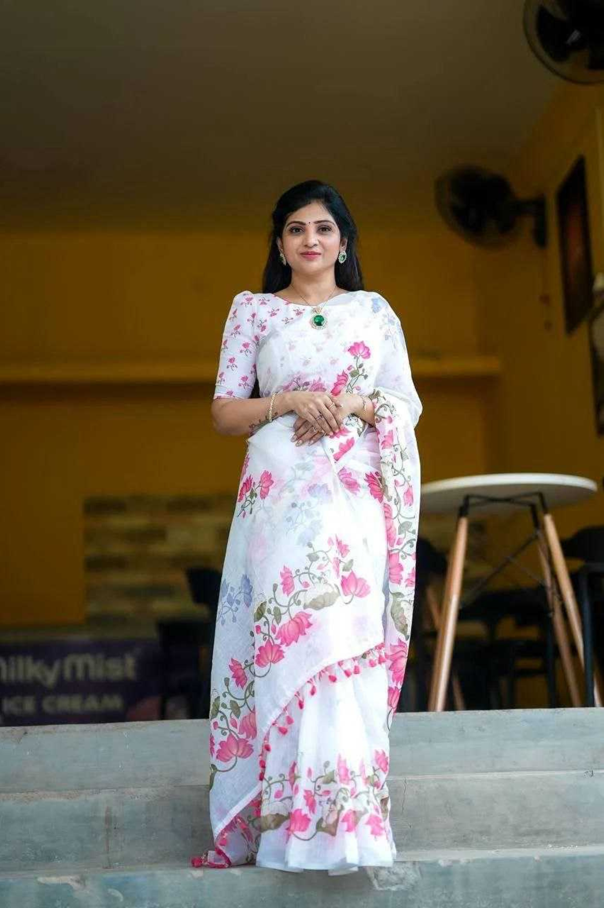 Elegant White Linen Saree with Floral Digital Print & Tassel Detailing