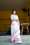 Elegant White Linen Saree with Floral Digital Print & Tassel Detailing